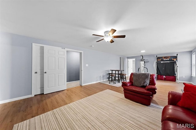 140 Shumard Oak Dr, Troy, MO 63379 - living room featuring wood finished floors, baseboards, and ceiling fan