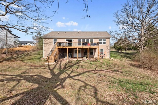 140 Shumard Oak Dr, Troy, MO 63379 - rear view of house with a wooden deck, stairs, and a lawn