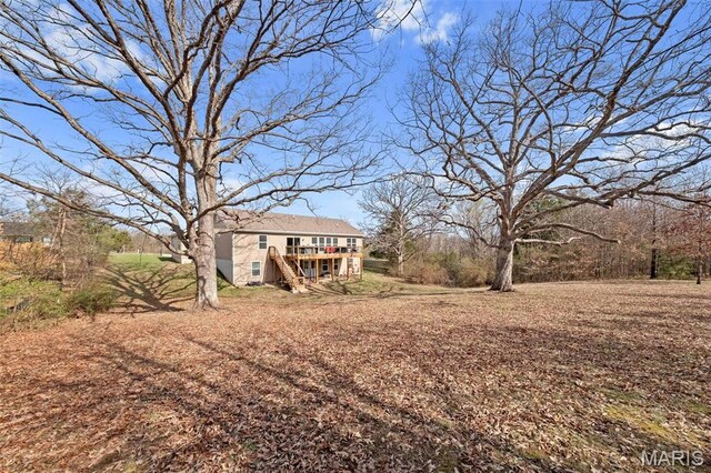 140 Shumard Oak Dr, Troy, MO 63379 - view of yard with stairs and a wooden deck