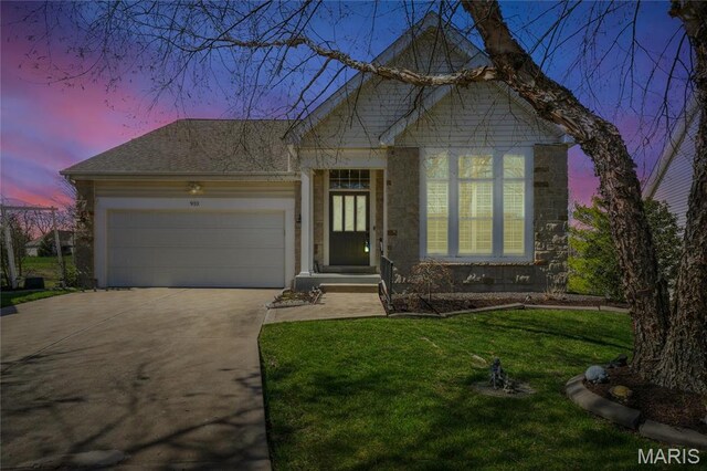 910 Ridgepointe Place Cir, Lake St Louis, MO 63367 - view of front of home with concrete driveway, an attached garage, a front lawn, and stone siding
