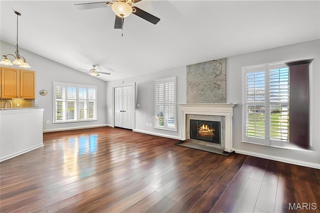 910 Ridgepointe Place Cir, Lake St Louis, MO 63367 - unfurnished living room with ceiling fan, vaulted ceiling, a fireplace, dark wood finished floors, and baseboards
