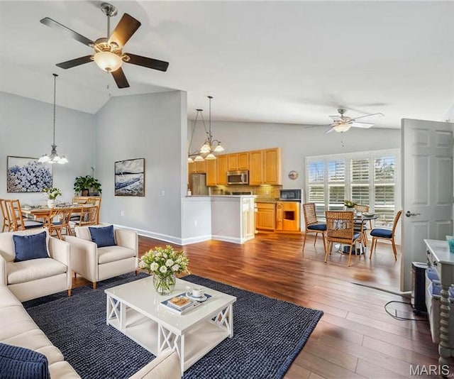 910 Ridgepointe Place Cir, Lake St Louis, MO 63367 - living area featuring ceiling fan, a chandelier, wood finished floors, baseboards, and high vaulted ceiling
