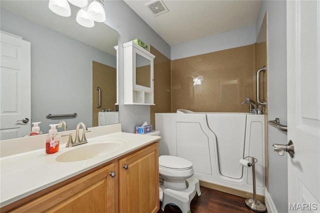 910 Ridgepointe Place Cir, Lake St Louis, MO 63367 - full bathroom with wood finished floors, vanity, a shower, and toilet