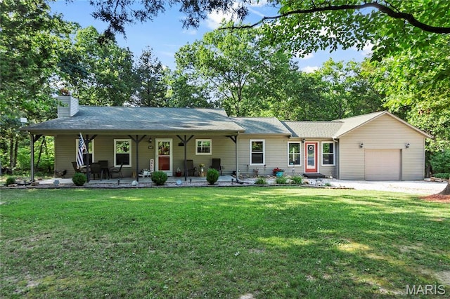 5057 Port Perry Dr, Perryville, MO 63775 - ranch-style home featuring a garage, a front lawn, a chimney, covered porch, and driveway