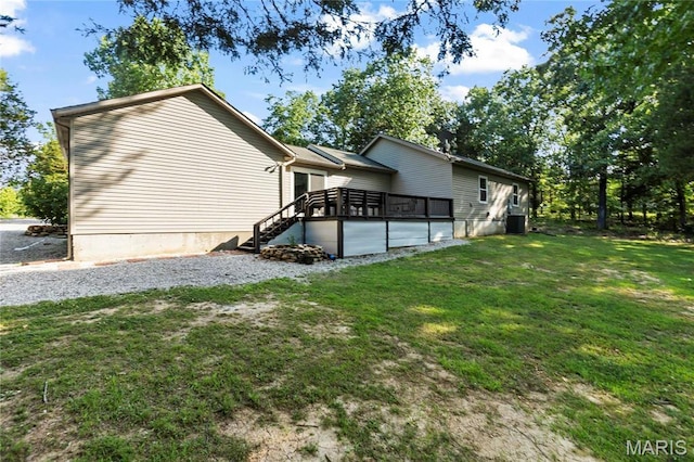 5057 Port Perry Dr, Perryville, MO 63775 - view of side of property featuring a yard, a deck, and stairs