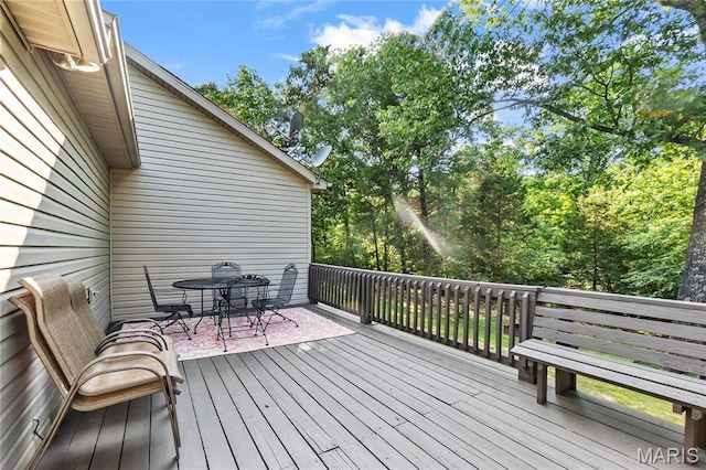 5057 Port Perry Dr, Perryville, MO 63775 - wooden terrace with outdoor dining space and view of wooded area