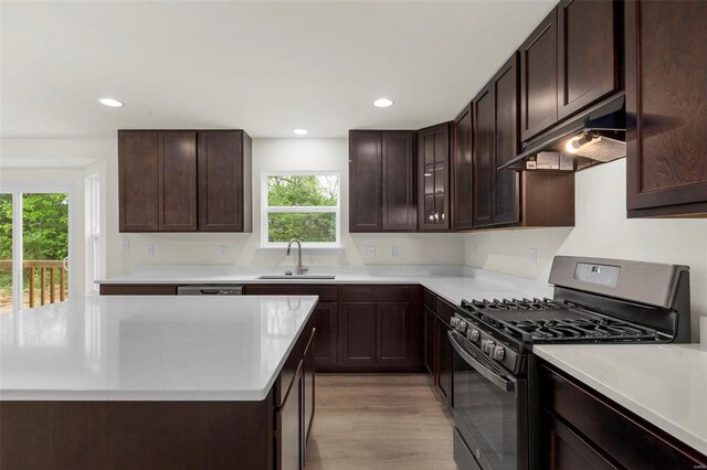 610 Tull Ct, Wentzville, MO 63385 - kitchen with stainless steel range with gas stovetop, under cabinet range hood, a sink, healthy amount of natural light, and recessed lighting