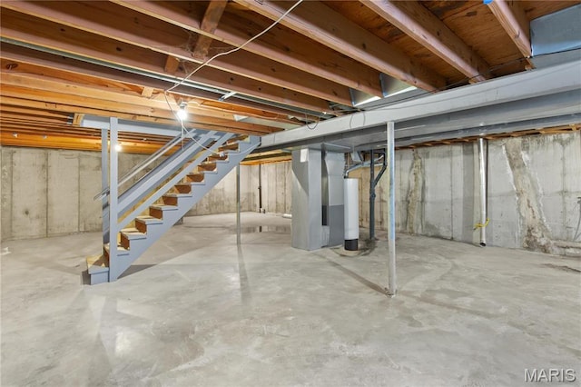 3524 Espace Ct, Florissant, MO 63034 - unfinished basement featuring stairway and gas water heater