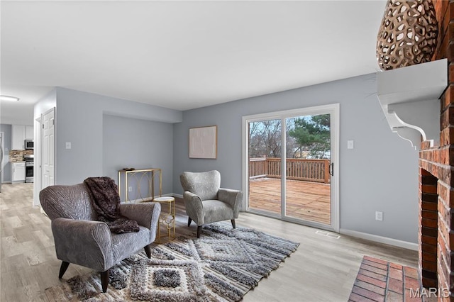 3524 Espace Ct, Florissant, MO 63034 - living area with light wood finished floors and baseboards