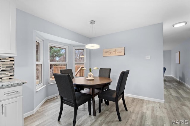 3524 Espace Ct, Florissant, MO 63034 - dining space with light wood finished floors and baseboards