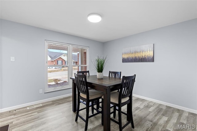 3524 Espace Ct, Florissant, MO 63034 - dining space featuring light wood-type flooring and baseboards