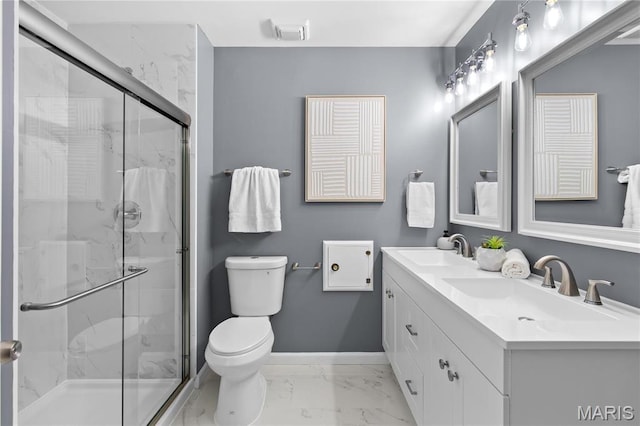 3524 Espace Ct, Florissant, MO 63034 - bathroom with marble look tile flooring, double vanity, toilet, and a marble finish shower