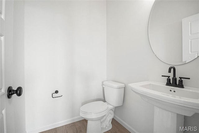 177 Arpent Aly, Saint Charles, MO 63301 - bathroom featuring baseboards and wood finished floors