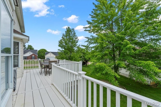 2 Meramec Shores Ct, Ofallon, MO 63366 - wooden terrace with outdoor dining space and a yard