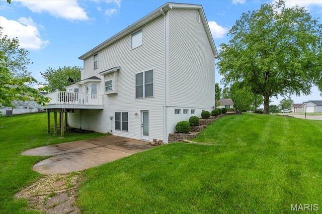 2 Meramec Shores Ct, Ofallon, MO 63366 - back of property with a lawn, a deck, and a patio area