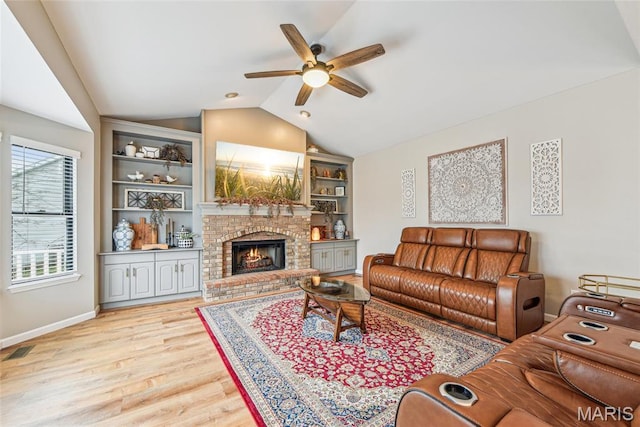 2 Meramec Shores Ct, Ofallon, MO 63366 - living room with lofted ceiling, ceiling fan, wood finished floors, a fireplace, and baseboards
