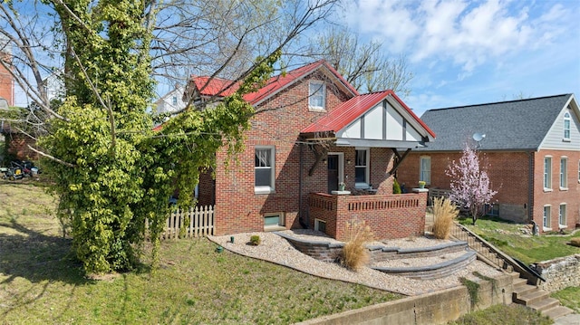 125 W 2nd St, Hermann, MO 65041 - view of front of property featuring brick siding, stairway, and covered porch