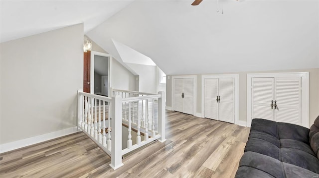 125 W 2nd St, Hermann, MO 65041 - additional living space featuring wood finished floors, vaulted ceiling, baseboards, and ceiling fan