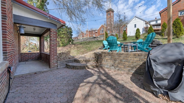125 W 2nd St, Hermann, MO 65041 - view of patio with a fire pit, area for grilling, and a residential view