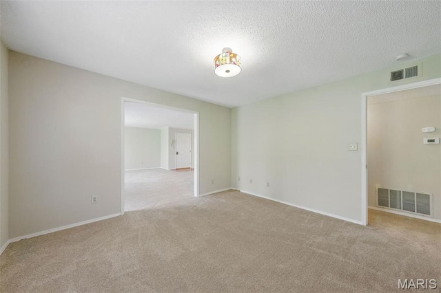 2037 Trailcrest Ln Unit 7, Saint Louis, MO 63122 - unfurnished room with carpet, baseboards, and a textured ceiling