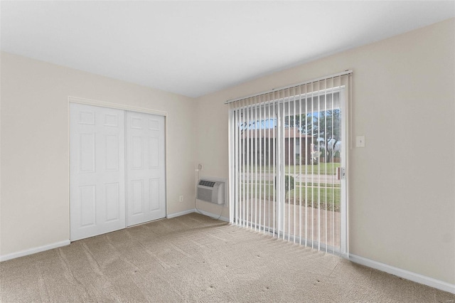 unfurnished bedroom with carpet, baseboards, a closet, and access to exterior
