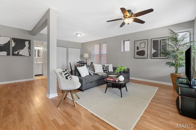 3618 Mcree Ave, Saint Louis, MO 63110 - living area featuring light wood-type flooring, baseboards, and a ceiling fan