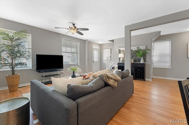 3618 Mcree Ave, Saint Louis, MO 63110 - living area with ceiling fan, light wood-type flooring, and baseboards