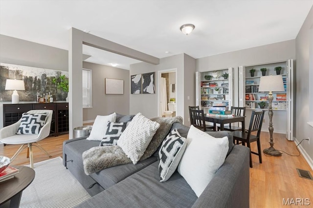 3618 Mcree Ave, Saint Louis, MO 63110 - living area featuring light wood-type flooring and baseboards