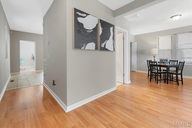 3618 Mcree Ave, Saint Louis, MO 63110 - hallway featuring light wood-type flooring and baseboards