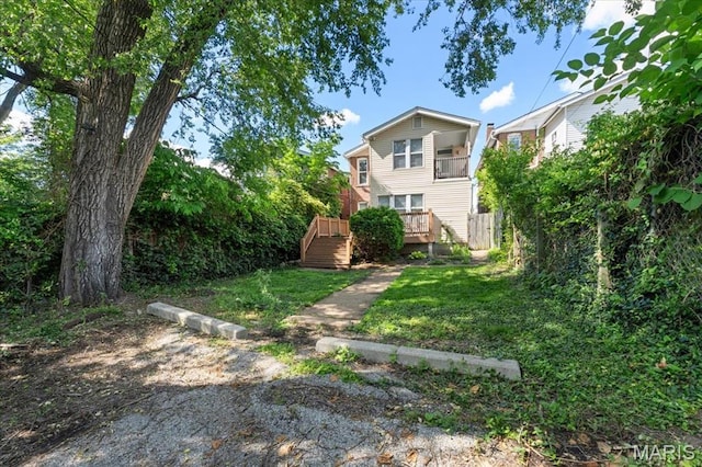 3618 Mcree Ave, Saint Louis, MO 63110 - view of grassy yard with a wooden deck