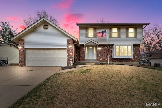 2915 Coram Dr, Saint Louis, MO 63129 - view of front of property with concrete driveway, an attached garage, brick siding, and a yard