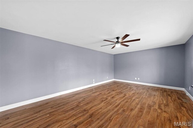 2915 Coram Dr, Saint Louis, MO 63129 - unfurnished room featuring a ceiling fan, dark wood finished floors, and baseboards