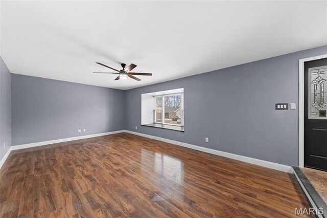 2915 Coram Dr, Saint Louis, MO 63129 - spare room featuring ceiling fan, wood finished floors, and baseboards
