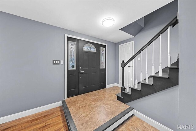 2915 Coram Dr, Saint Louis, MO 63129 - entrance foyer with baseboards, stairs, and wood finished floors