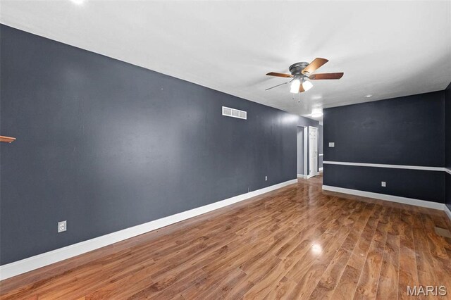2915 Coram Dr, Saint Louis, MO 63129 - spare room with a ceiling fan, wood finished floors, and baseboards