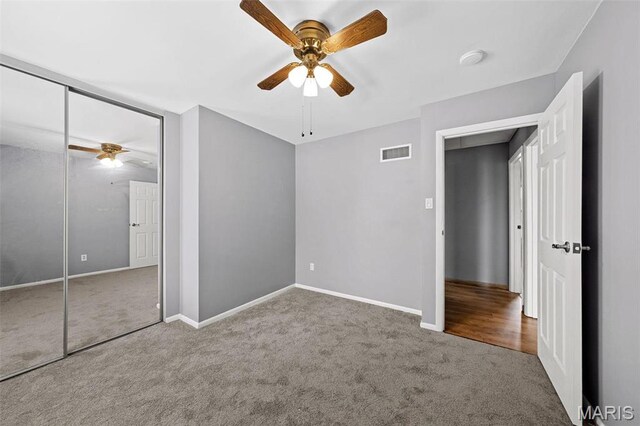 2915 Coram Dr, Saint Louis, MO 63129 - unfurnished bedroom with carpet floors, a closet, baseboards, and ceiling fan