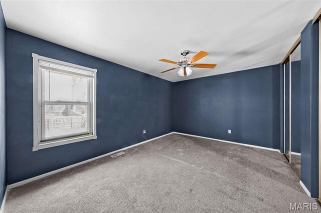 2915 Coram Dr, Saint Louis, MO 63129 - unfurnished room featuring carpet floors, ceiling fan, and baseboards