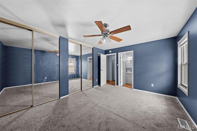 2915 Coram Dr, Saint Louis, MO 63129 - unfurnished bedroom with carpet floors, two closets, baseboards, and ensuite bath