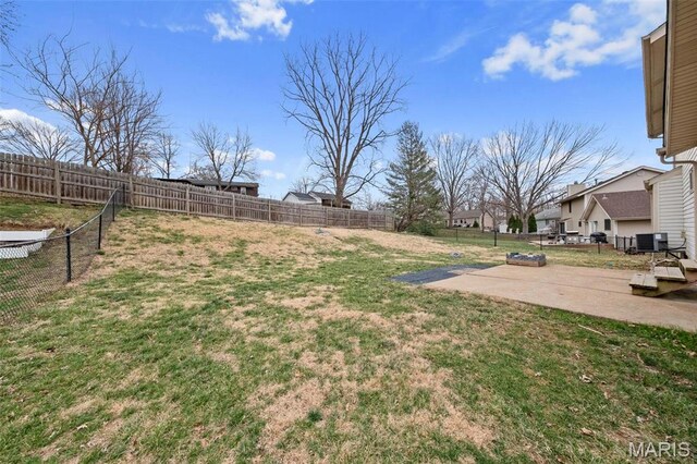 2915 Coram Dr, Saint Louis, MO 63129 - view of yard featuring a patio area, central air condition unit, and a residential view