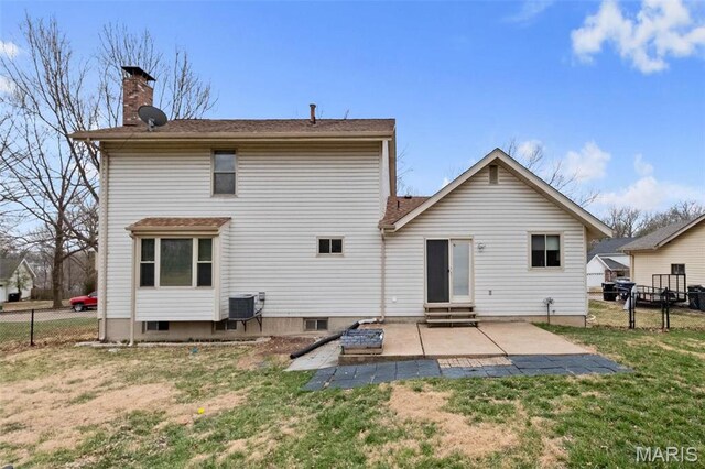 2915 Coram Dr, Saint Louis, MO 63129 - rear view of house featuring a patio, entry steps, a chimney, and central air condition unit