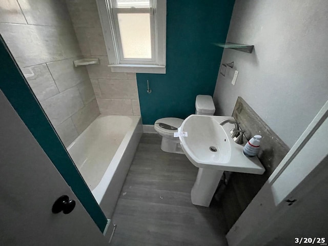 145 S 34th St, Belleville, IL 62226 - full bath featuring wood finished floors, toilet, a sink, and baseboards