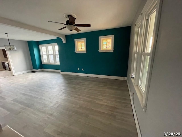 145 S 34th St, Belleville, IL 62226 - spare room with a ceiling fan, wood finished floors, and baseboards