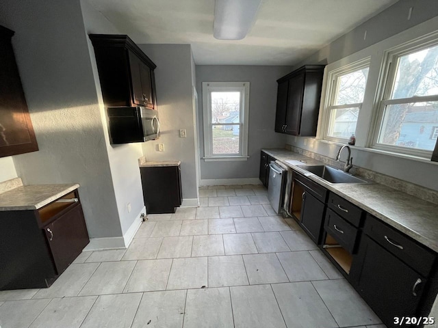 145 S 34th St, Belleville, IL 62226 - kitchen featuring a sink, plenty of natural light, dishwasher, and baseboards