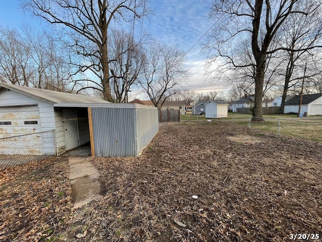 145 S 34th St, Belleville, IL 62226 - view of yard with fence, an outbuilding, and a residential view