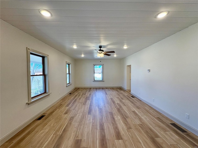 107 S Jackson St, Perryville, MO 63775 - empty room featuring light wood finished floors, baseboards, ceiling fan, and recessed lighting
