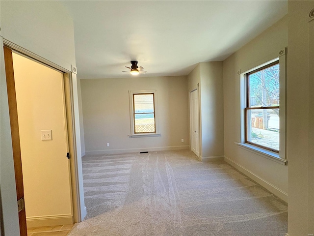 107 S Jackson St, Perryville, MO 63775 - empty room with a ceiling fan, baseboards, and light colored carpet