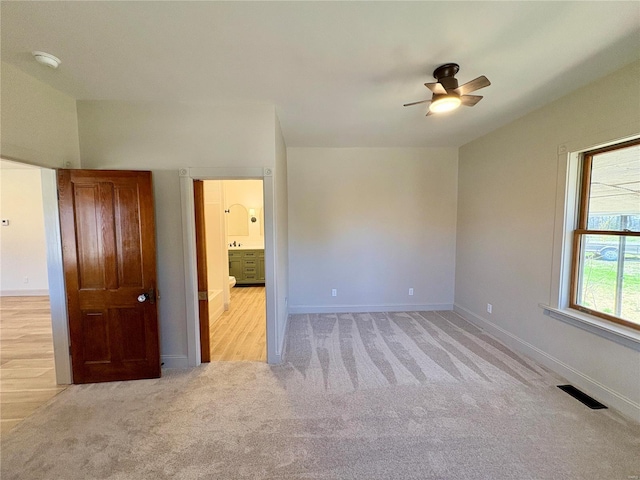 107 S Jackson St, Perryville, MO 63775 - unfurnished bedroom featuring carpet, baseboards, and ceiling fan
