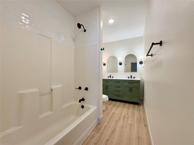 107 S Jackson St, Perryville, MO 63775 - bathroom with wood finished floors,  shower combination, double vanity, baseboards, and toilet