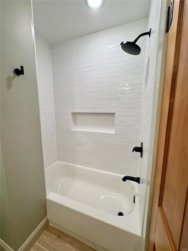 107 S Jackson St, Perryville, MO 63775 - bathroom with baseboards, shower / bath combination, and wood finished floors