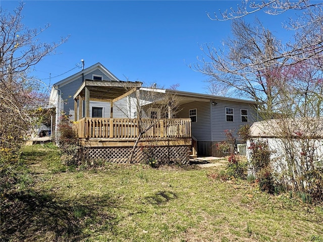 107 S Jackson St, Perryville, MO 63775 - back of house with a wooden deck and a lawn